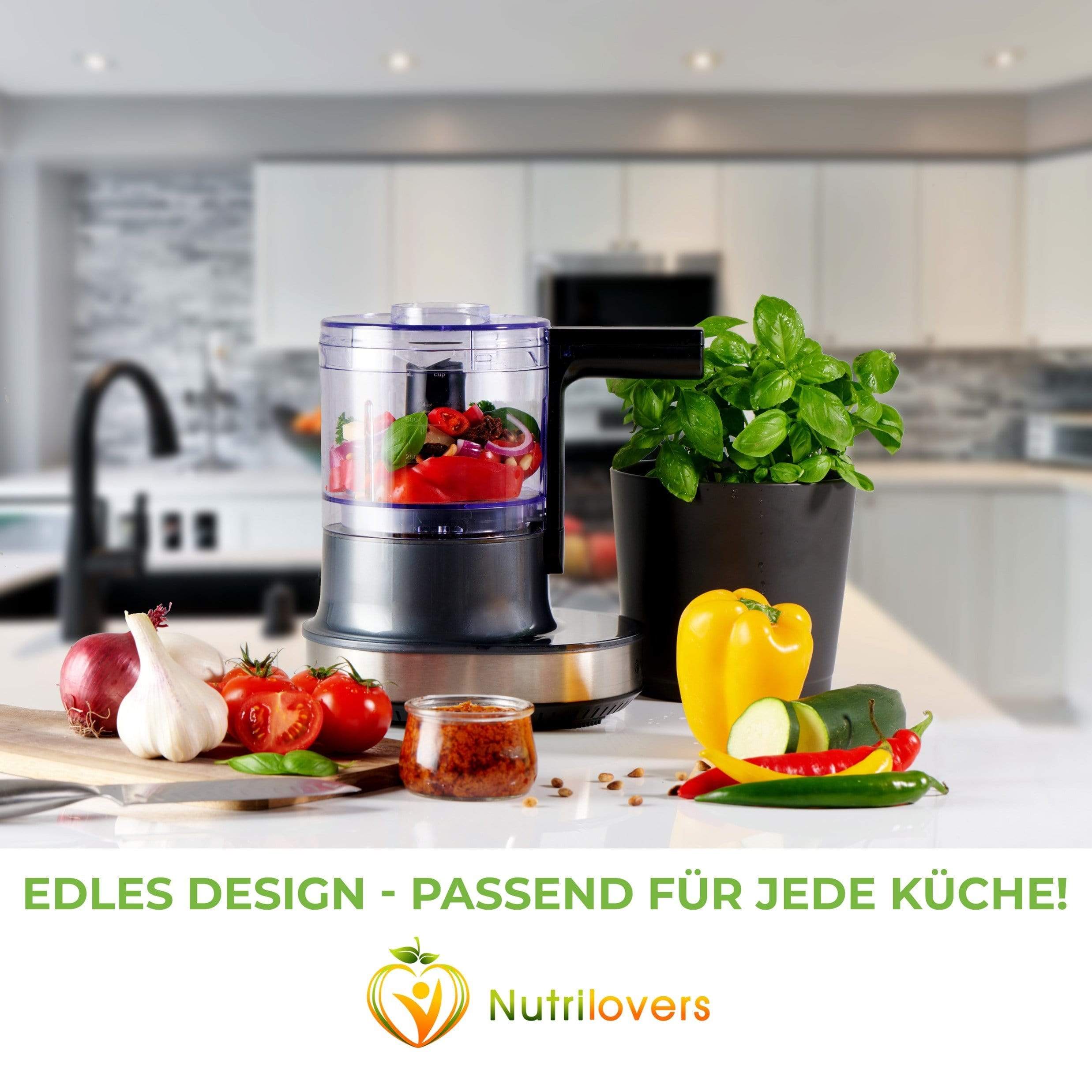 Schwarz-grauer Küchen-Multizerkleinerer, ideal für frisches Gemüse, mit edlem Design für jede Küche.